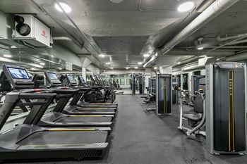 Fitness center with cardio and strength training equipment 2